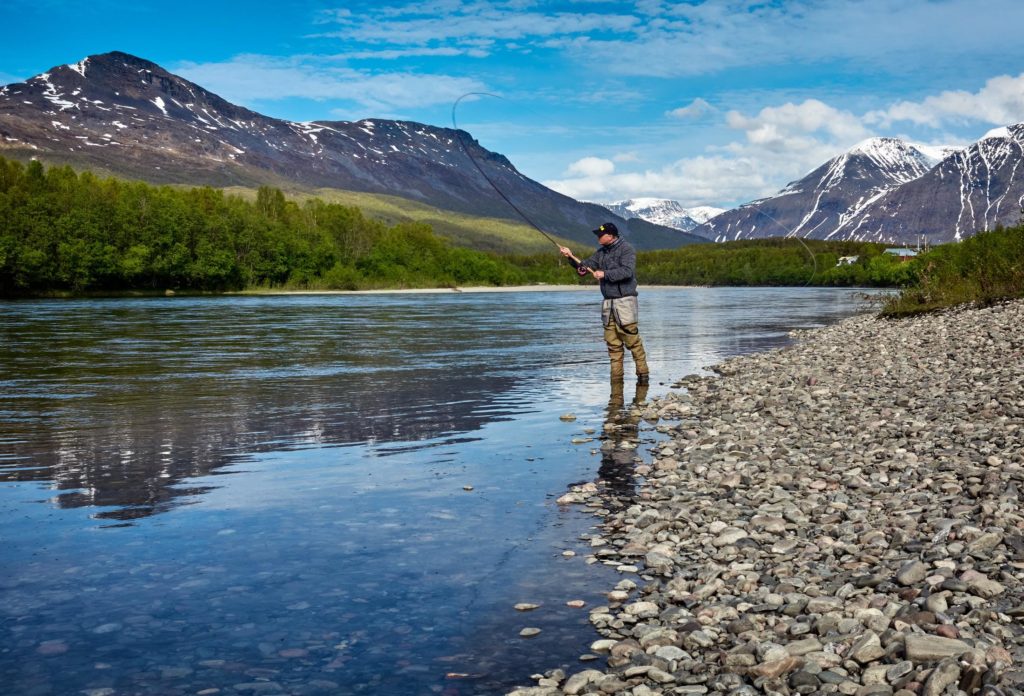 man fishing on the river (by Vidar Nordli-Mathisen on Unsplash)